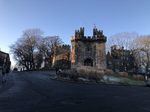 John O’Gaunt gateway at Lancaster Castle with medieval stone towers and archway entrance the starting point of our Lancaster walks itinerary